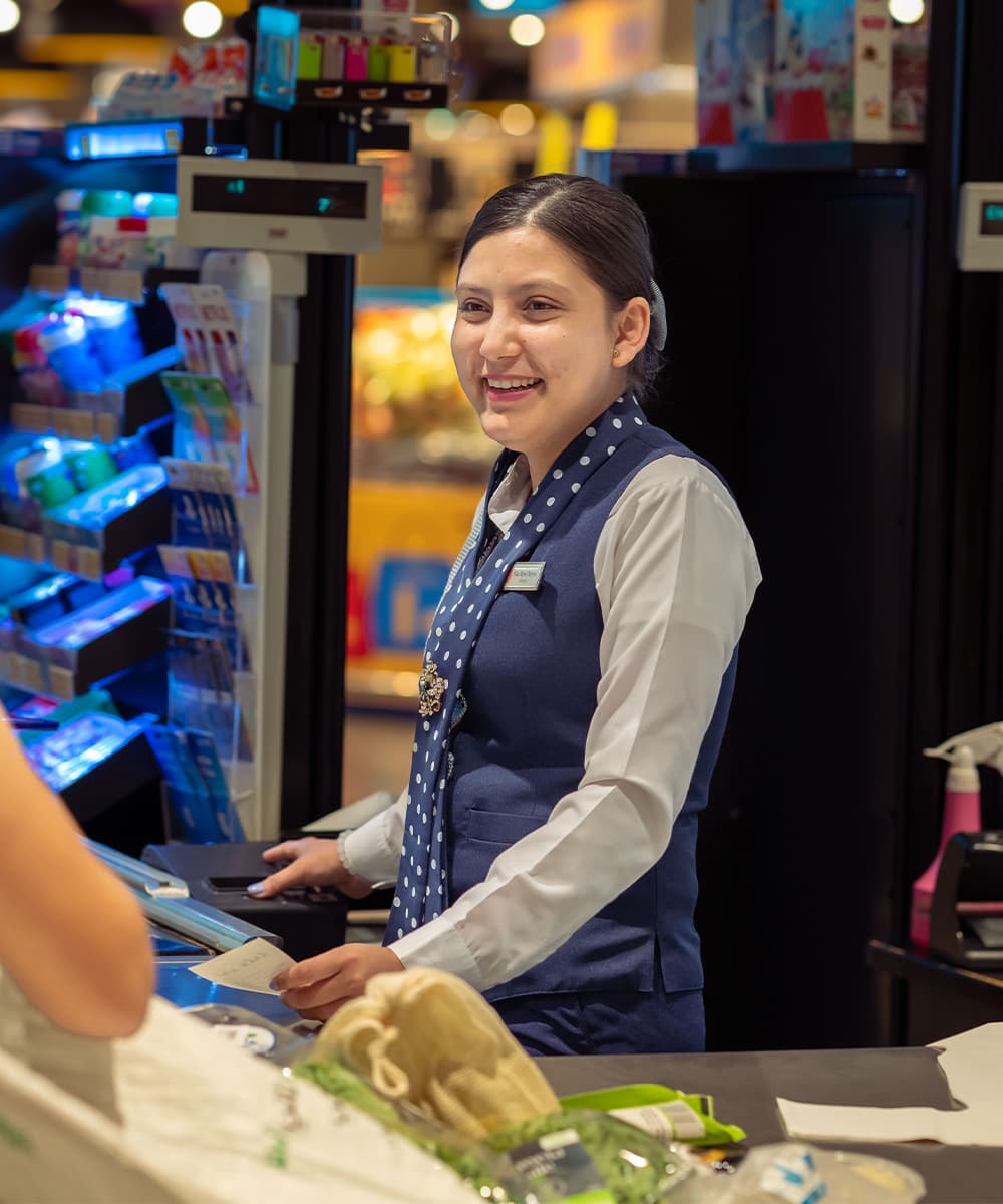 A LuLu team member serving shoppers